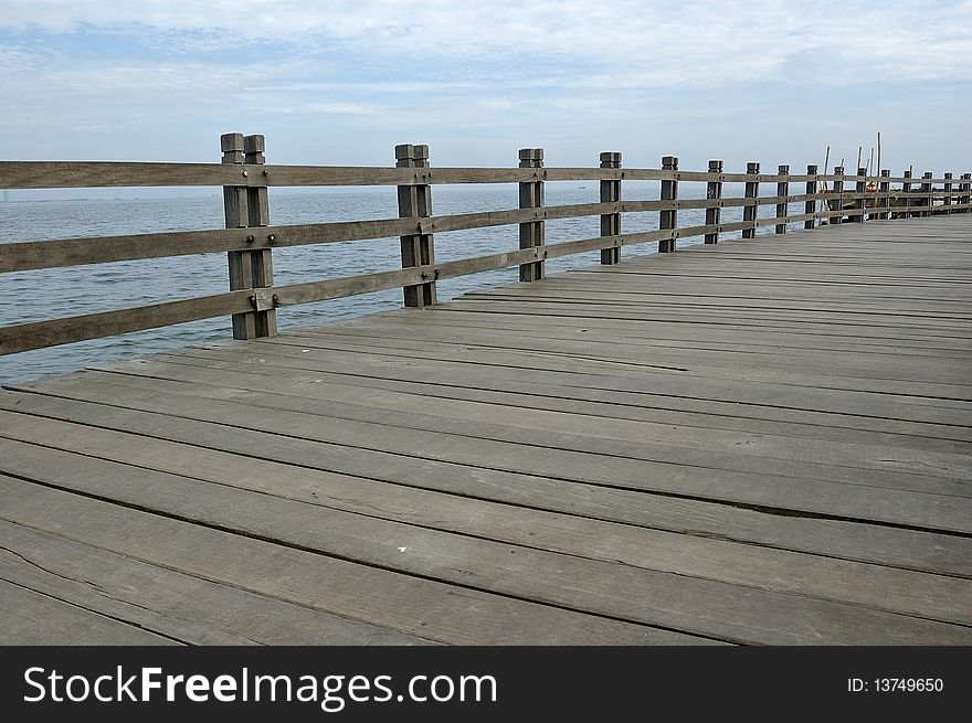 Wooden dock at the sea, located in Ancol, Indonesia
