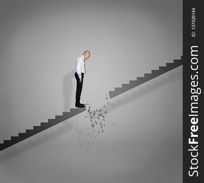 Businessman Looking Down on Broken Stairs