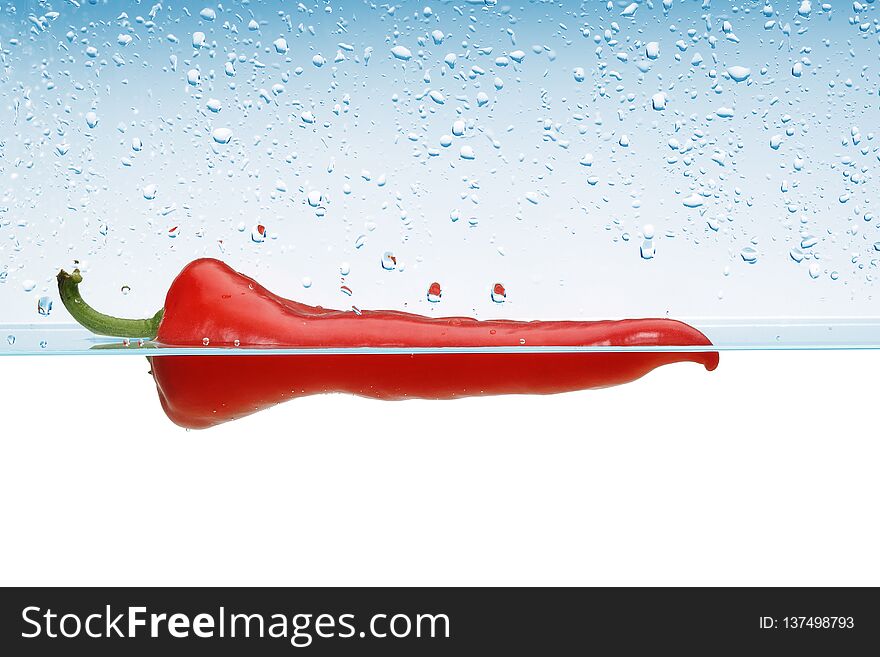 Single Red pepper in water