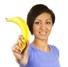 Smiling Young Woman Holds A Banana Stock Photo Smiling Young Woman Holds A Banana Stock Photo