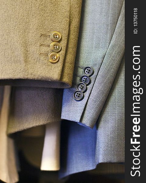 Close up of sleeves and cuffs of two men's jackets. Close up of sleeves and cuffs of two men's jackets