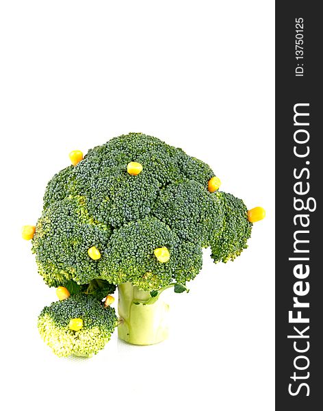 Broccoli tree with some corn fruits on white background - symbol of growth and crop