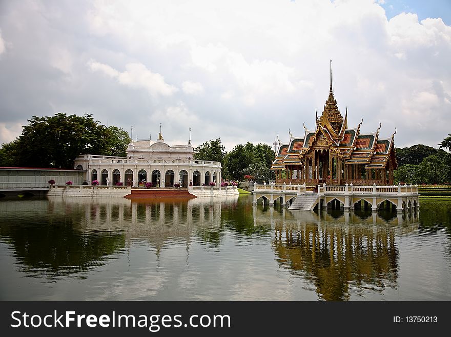 A castle of palace in Thailand with water reflect