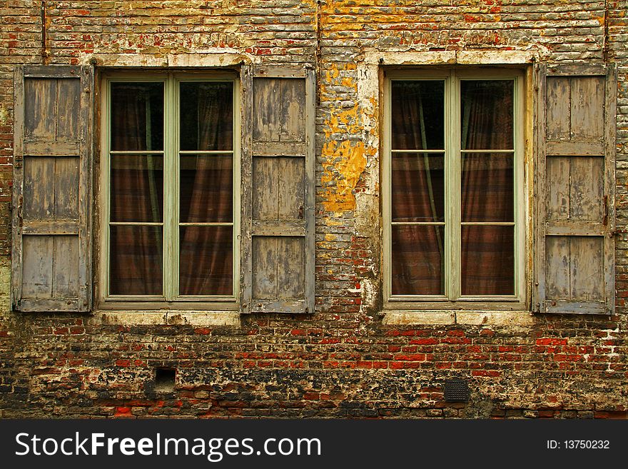 Closeup on two windows with shutters