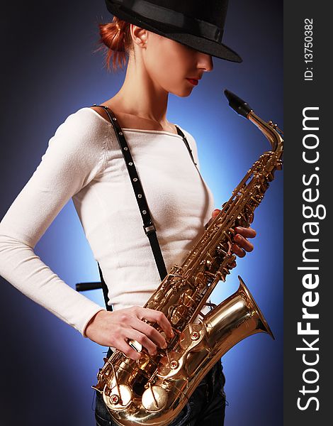 young woman with saxophone. young woman with saxophone