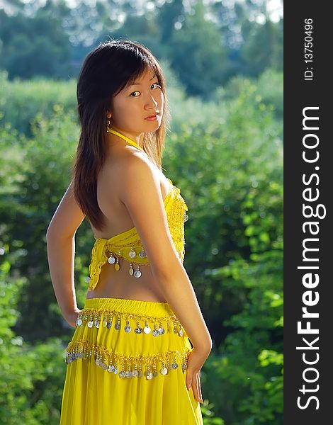 Pretty girl dancing in yellow indian dress. Pretty girl dancing in yellow indian dress