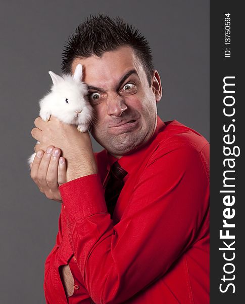 Funny man with white baby rabbit. Funny man with white baby rabbit