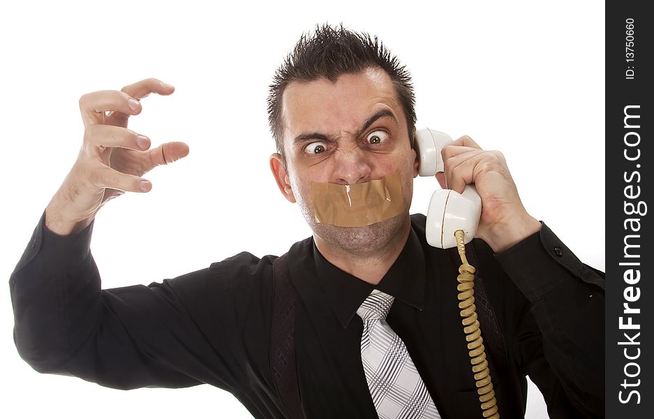 Funny businessman with tape on his mouth listening to someone on phone