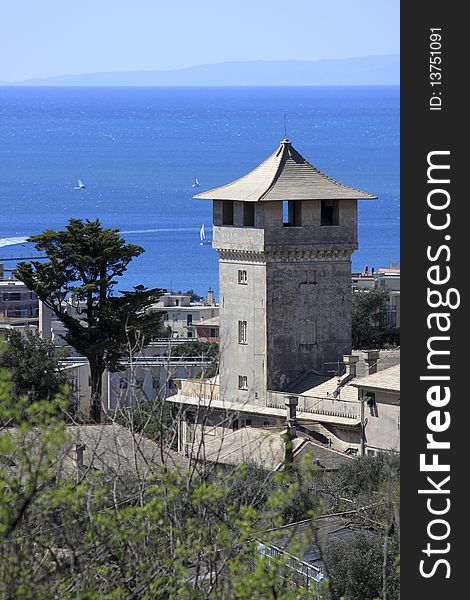 An old beautiful tower over a blue sea. An old beautiful tower over a blue sea.