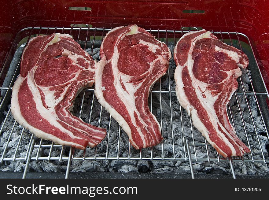 Some slices of beef on the grill. Some slices of beef on the grill