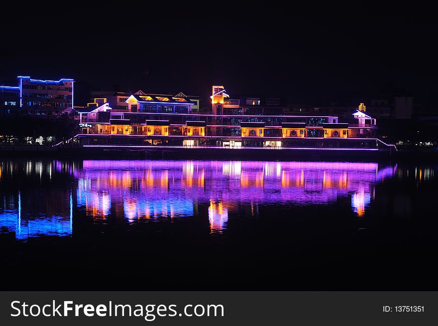 City by water at night in china.