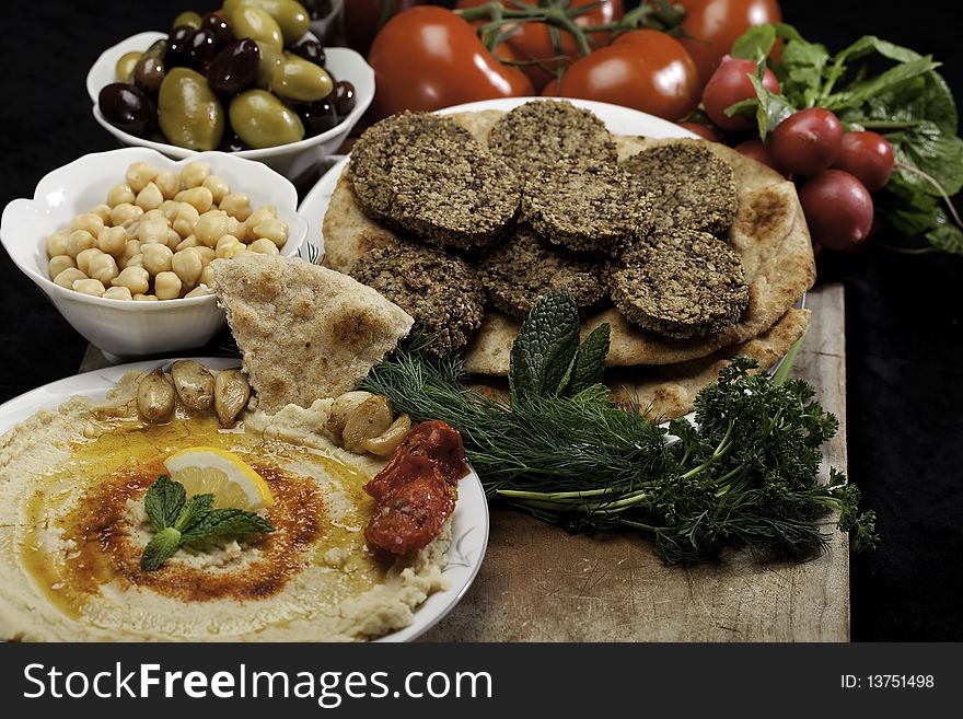 Humus and Falafels with chickpeas, radishes and tomatoes.