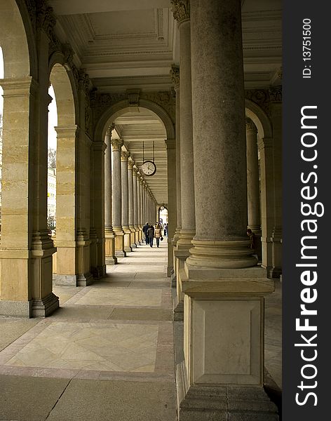 Stone colonnade with marble floor