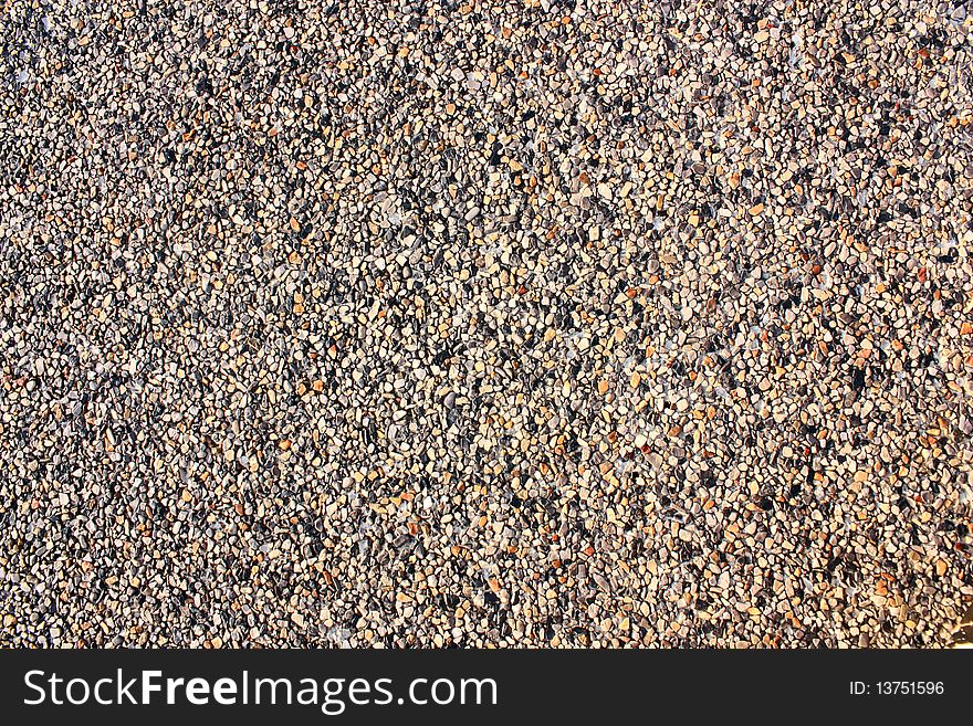 A small stone background texture of smooth stones.