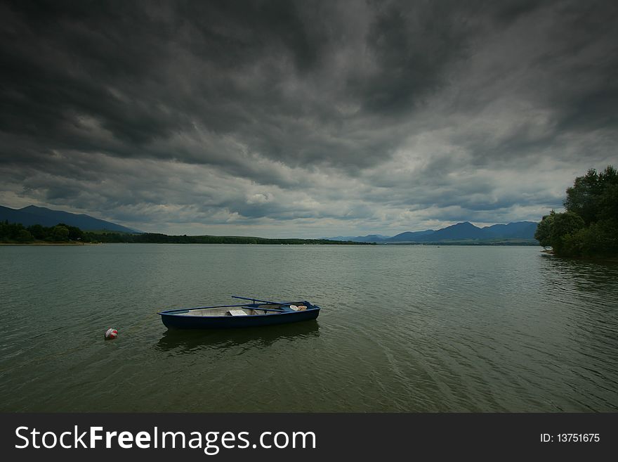 Lake Liptovska Mara with boat (Slovakia). Lake Liptovska Mara with boat (Slovakia)