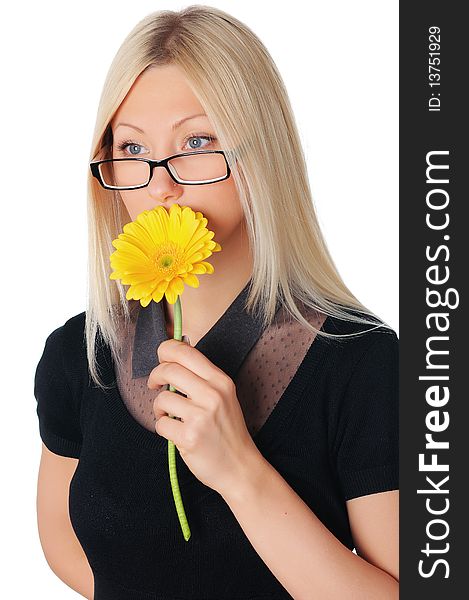 Charming young business woman with a yellow flower in the hands