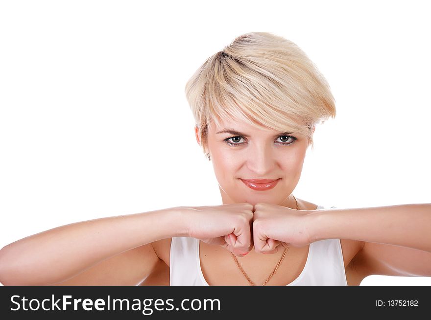 A charming young girl in a white T-shirt makes a sports exercise isolated on white