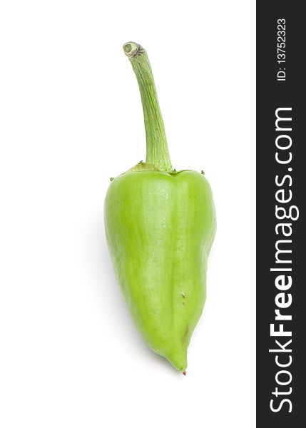 Composition from a green pepper on the white isolated background