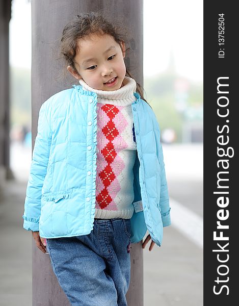 Cute little asian girl in blue.