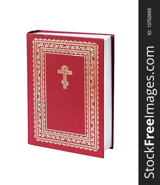 The big bible of red colour on a white background close up is isolated. The big bible of red colour on a white background close up is isolated