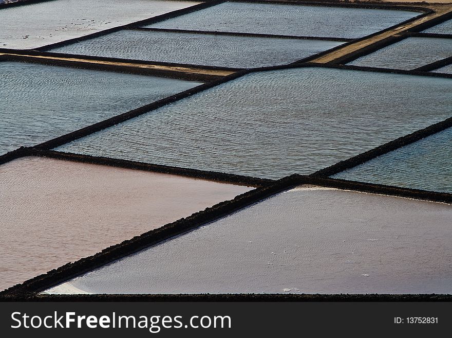 Traditional salt basins in the salina of Janubio in Lanzarote