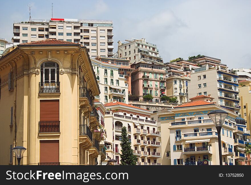 View of the many homes in Monaco Monte Carlo in the summer with the windows balconies