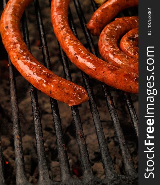 A sausage on grill with space for text under it.