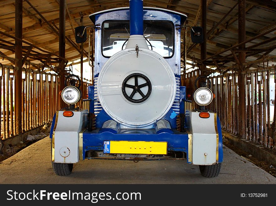 A train for kids and tourists in the garage. A train for kids and tourists in the garage.
