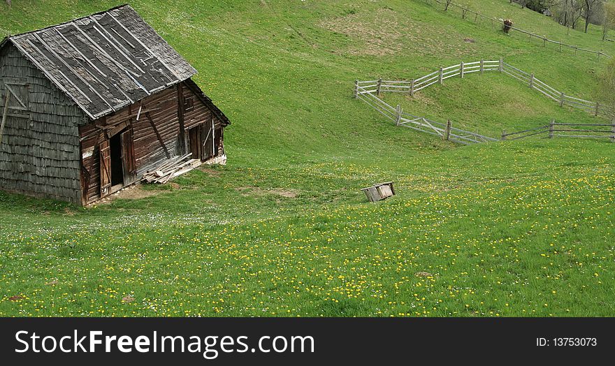 Rural landscape with deserted old wooden house on the hills. Rural landscape with deserted old wooden house on the hills