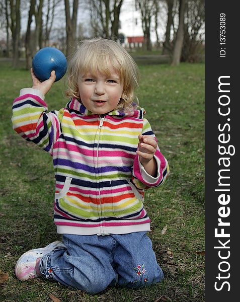 Little girl playing with ball