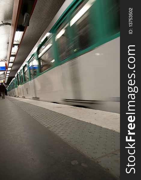 View of moving train in metro station of Paris. View of moving train in metro station of Paris