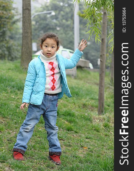 Cute Little Girl On Grass