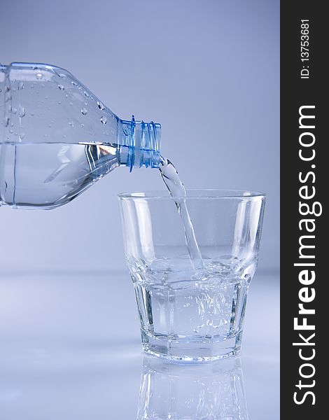 Mineral water being poured into a glass. Mineral water being poured into a glass