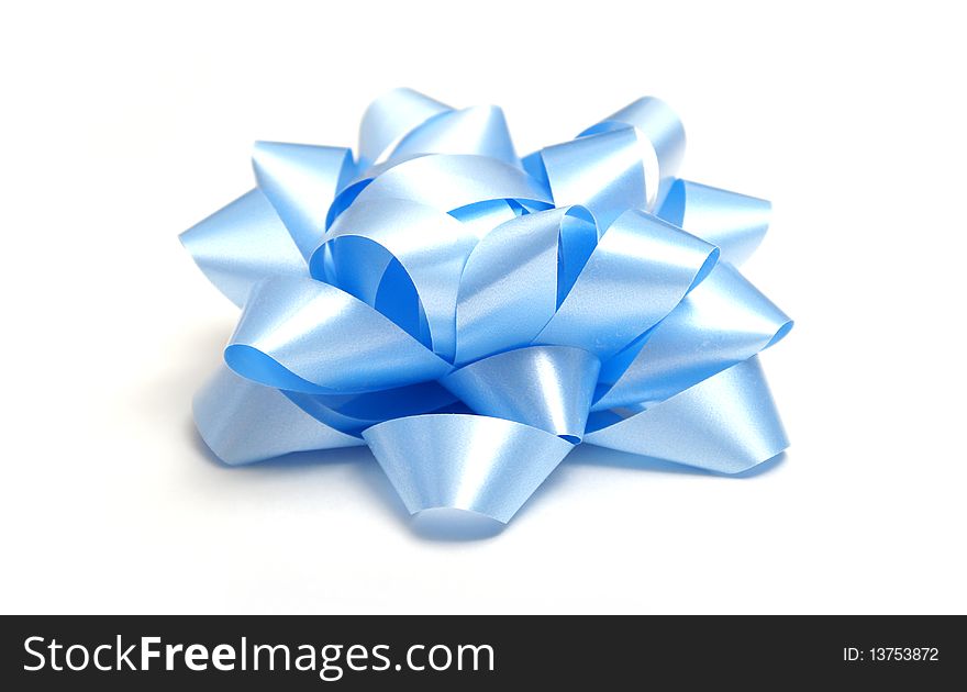 A macro shot of a nice blue bow isolated on white.