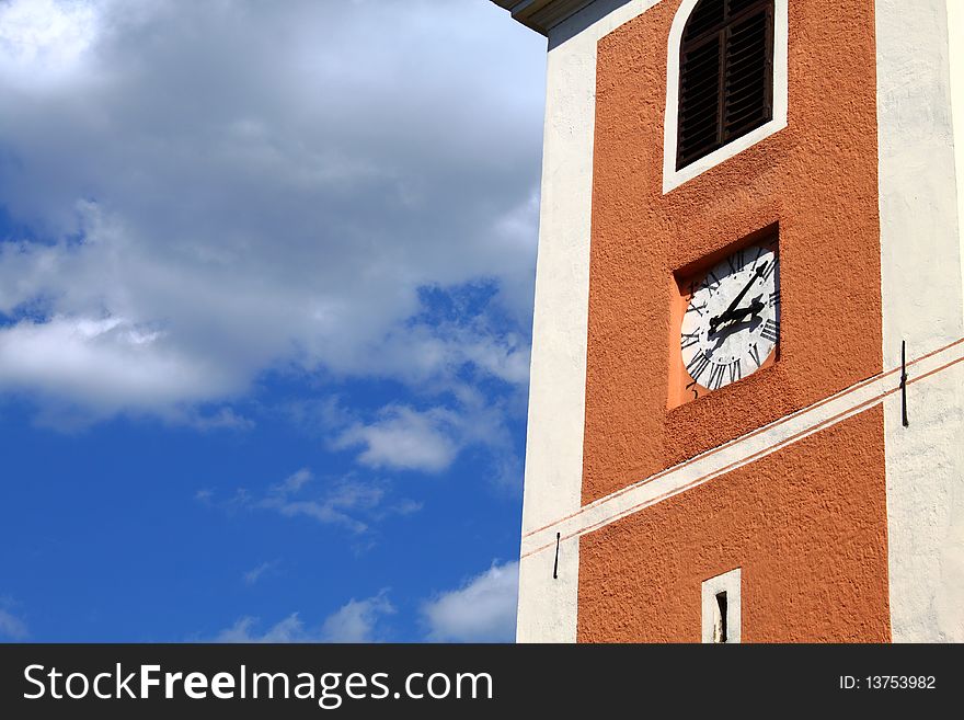 Old clock tower at 3.10 pm against partly cloudy blue sky. Old clock tower at 3.10 pm against partly cloudy blue sky