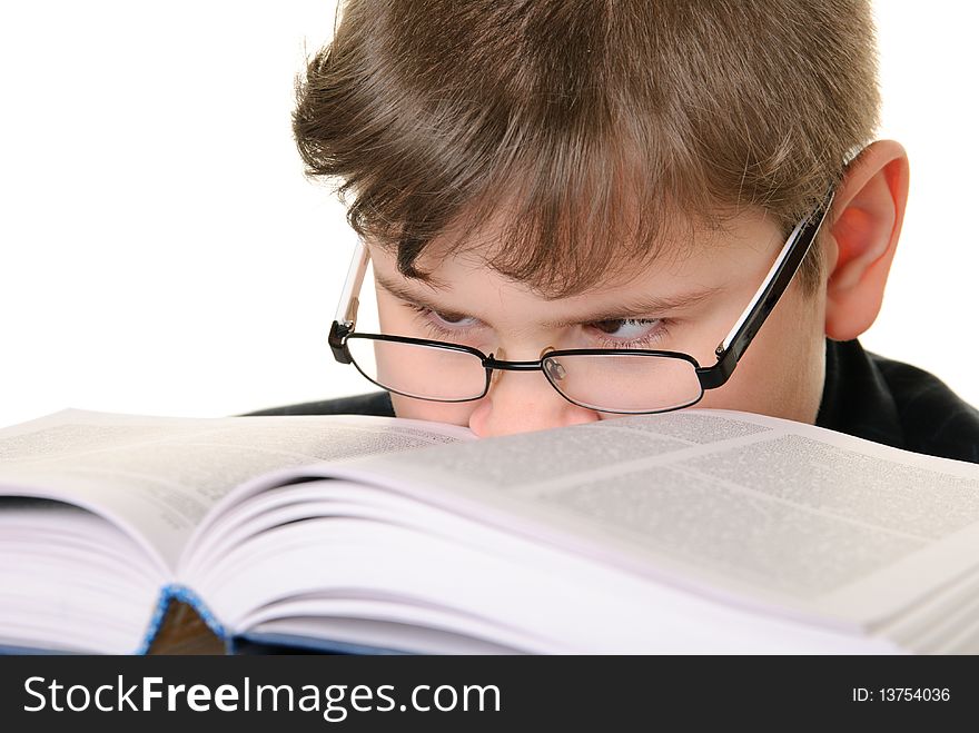 Boy Wearing Spectacles Attentively Reads Book