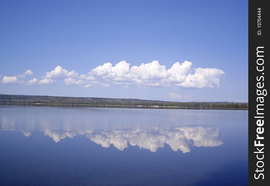 Clouds reflect on clear Yellowstone Lake USA. Clouds reflect on clear Yellowstone Lake USA
