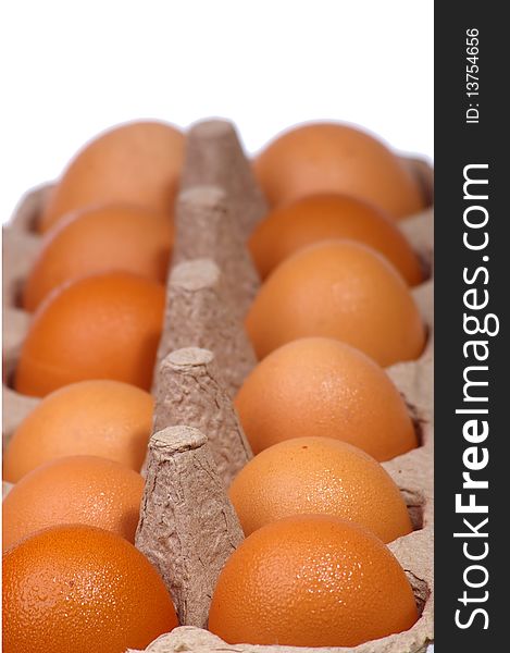 Rows of brown chicken eggs in egg carton