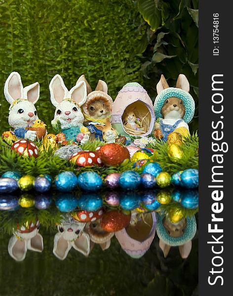 Easter bunnies and chocolate Easter eggs as decoration