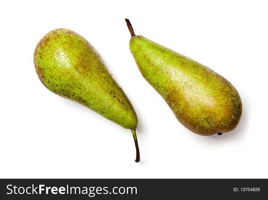 Two green speckled pears isolated on white. Two green speckled pears isolated on white.