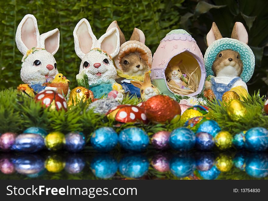 Easter bunnies and chocolate Easter eggs as decoration