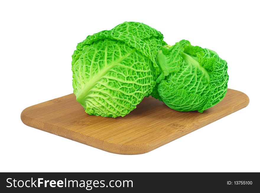 Savoy Cabbage On A Wooden Board