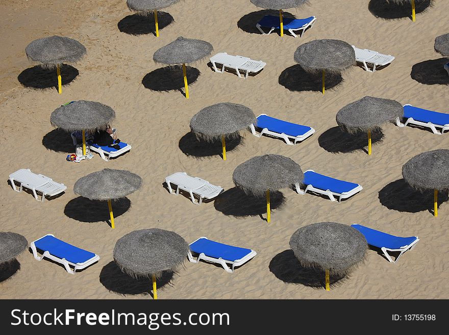 Several  sun loungers in the beach