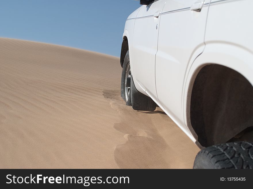 Car on soft sand dunes. Car on soft sand dunes