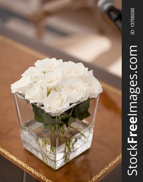 Vase with withe roses at a wedding. Vase with withe roses at a wedding