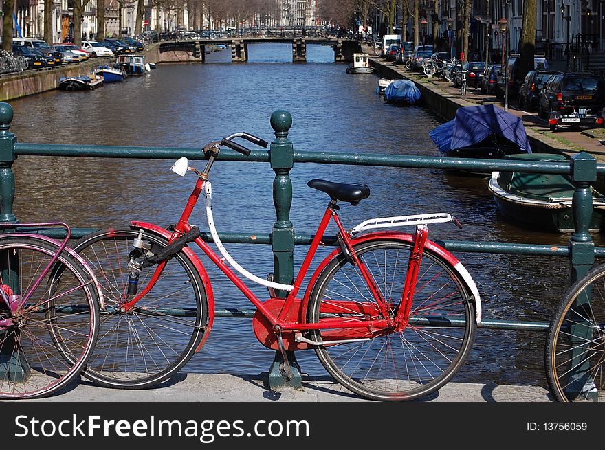 A bike on a bridge in Amsterdam. A bike on a bridge in Amsterdam