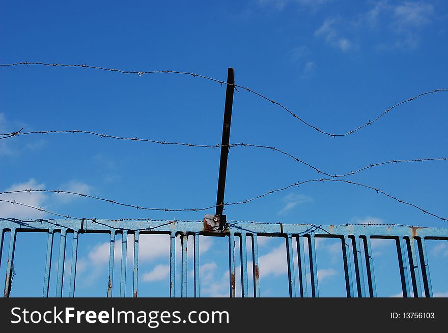 Barbed wire with a blue sky background