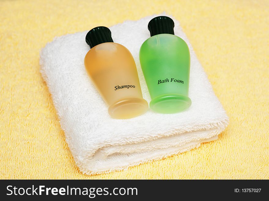 Spa or bathroom accessories: colorful towels, shampoos, bath foam