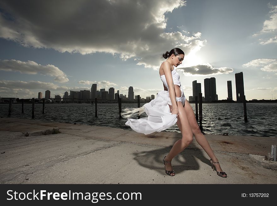 Attractive young woman posing in a fashionable costume. Attractive young woman posing in a fashionable costume