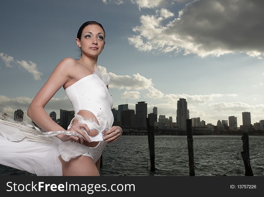 Attractive young woman posing in a fashionable costume. Attractive young woman posing in a fashionable costume